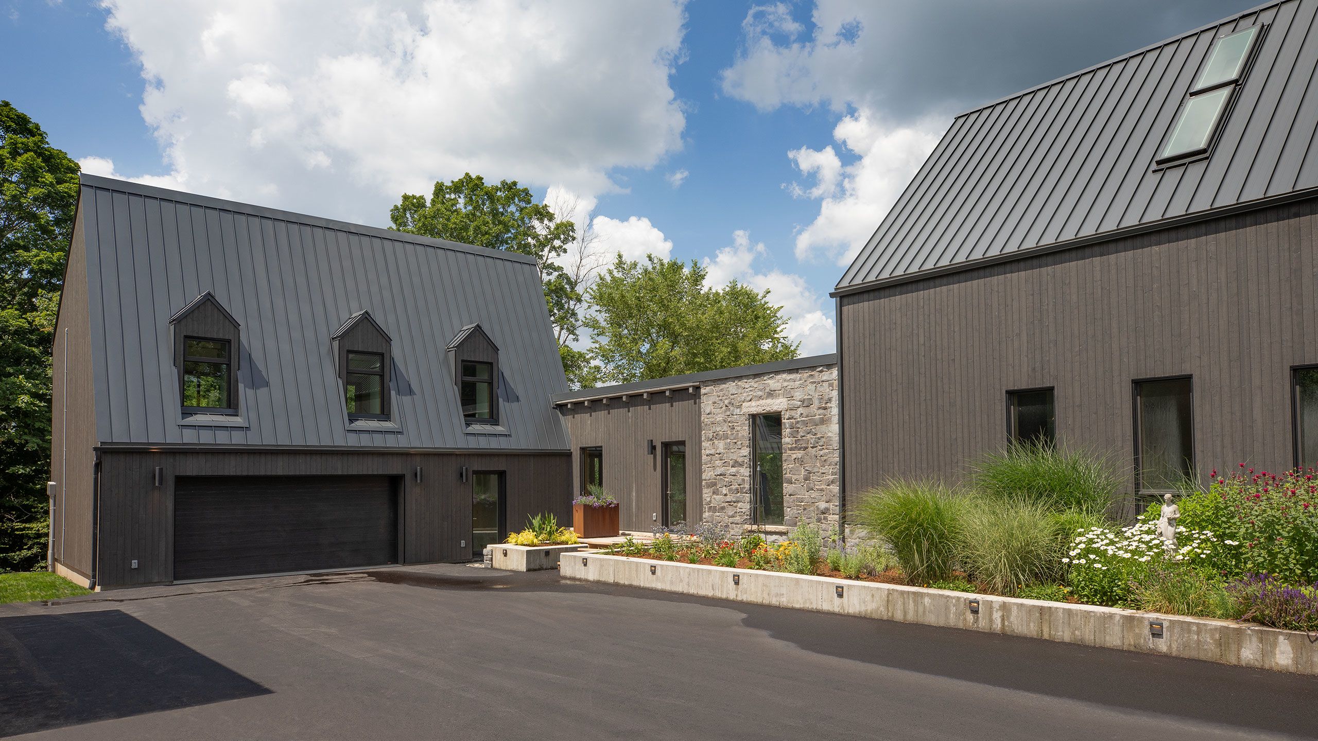 LONGHOUSE Extension showing two storey building with walkway to Main House on the right