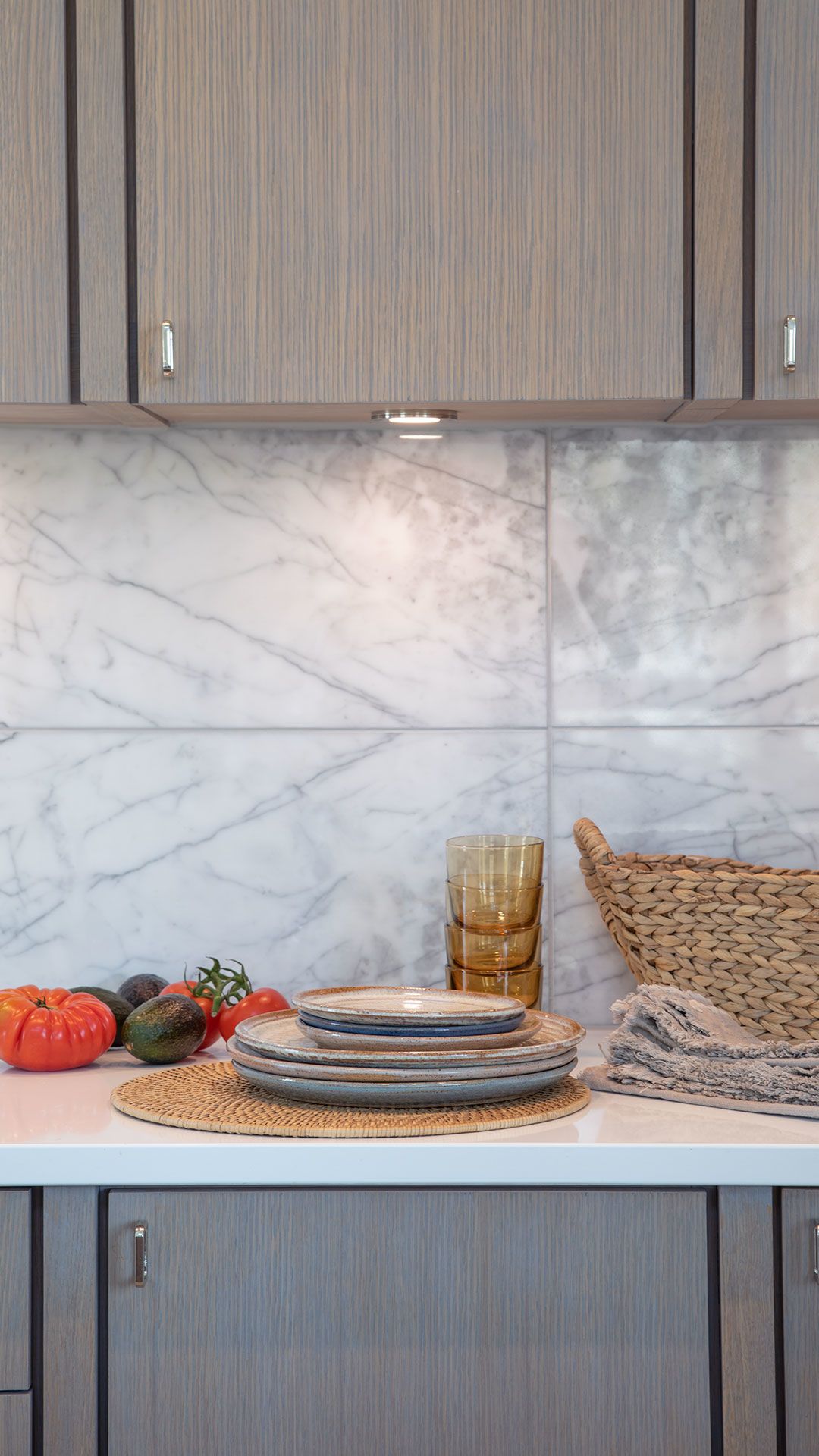 Detail of Statuario Marble kitchen backsplash and hand-finished white oak cabinets
