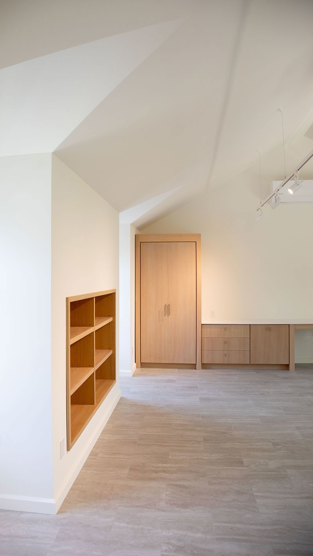 White oak builtin cabinets and bookcase detail.
