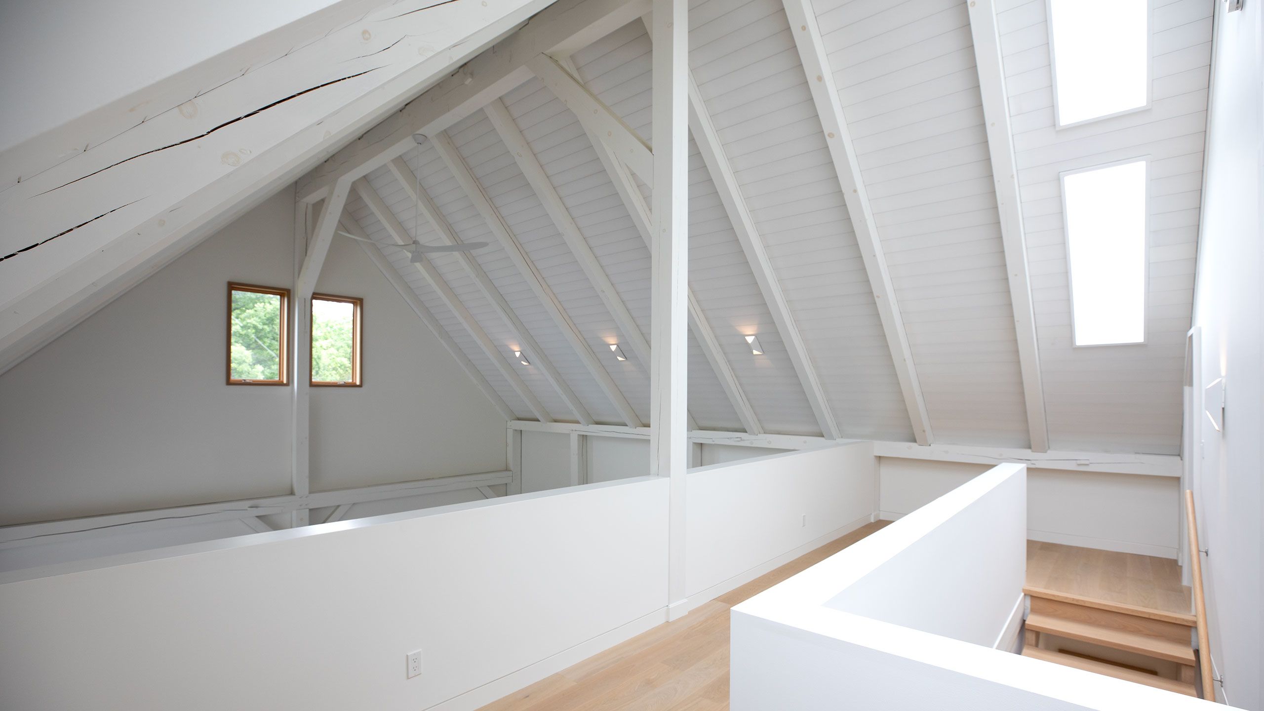 Second Level Loft with balcony walkway and skylights above